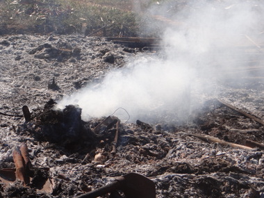 Home burning after helicopter attack on 28 December 2012