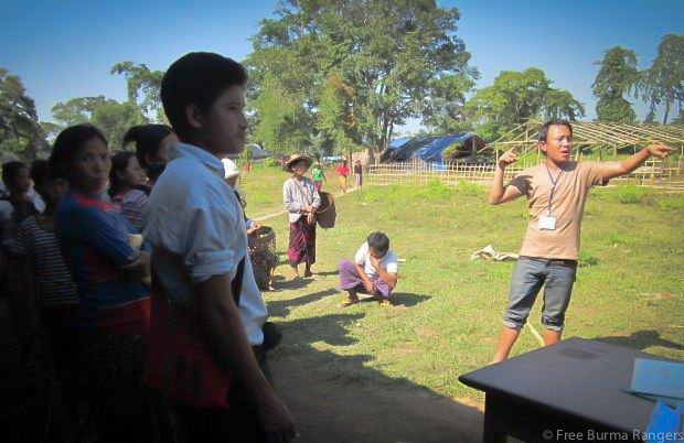 A Free Burma Ranger team member helps coordinate relief efforts for the 1,284 IDPs in Nam Lim Pa.