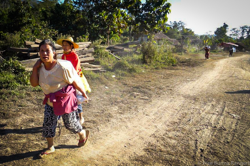 Families flee attacks from the Burma Army on 30 January 2014 Nam Gau, Kachin State.