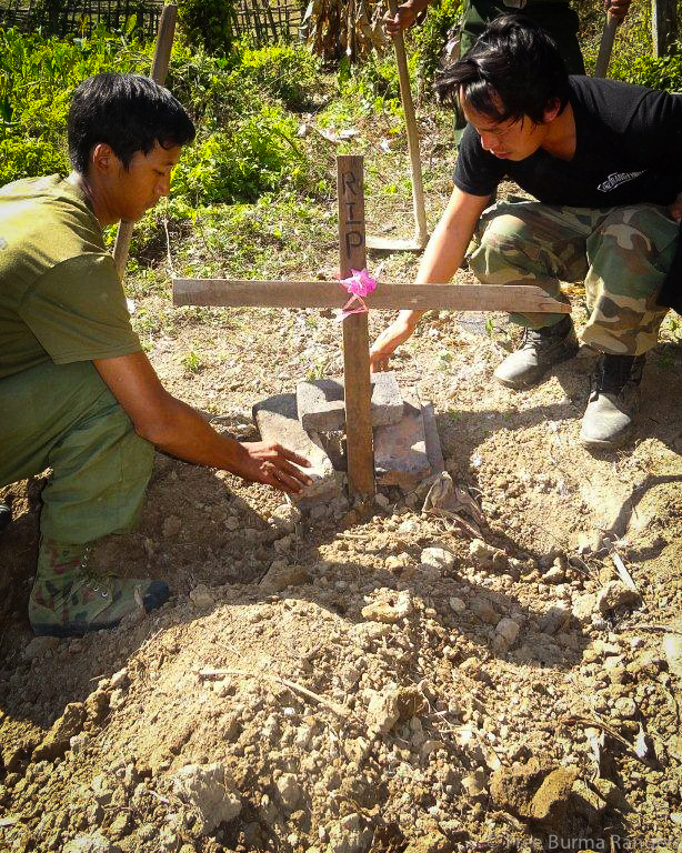 Rangers bury torture victims on 30 January 2014.