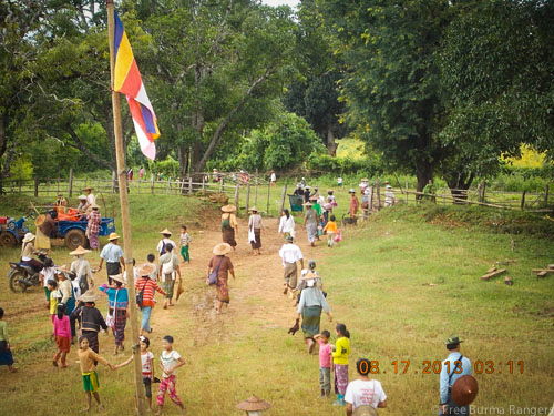Villagers fleeing their village as Burma Army soldiers came near.