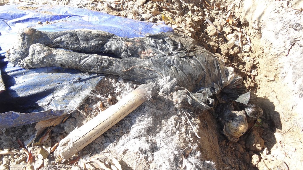 Body of one of the villagers tortured to death by Burma Army in Nam Lim Pa Village, Kachin State.