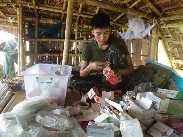 FBR Arakan Team medic checks mission supplies.