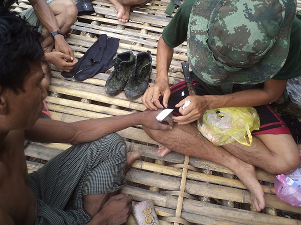 FBR team medic treats villager.