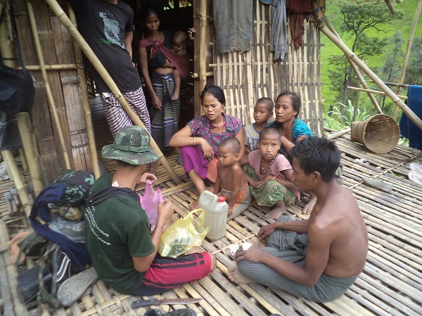 FBR team member assisting Arakanese family.