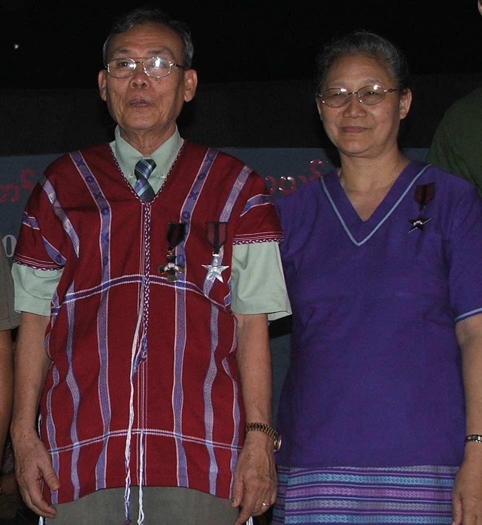 Rev. Dr. Saw Simon and his wife Naw Ta Blu Htoo with awards for service and valor