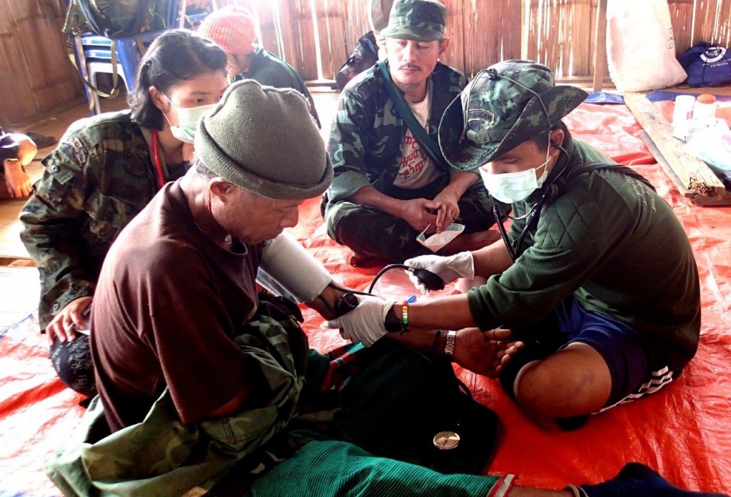 Karen medics treat a patient.