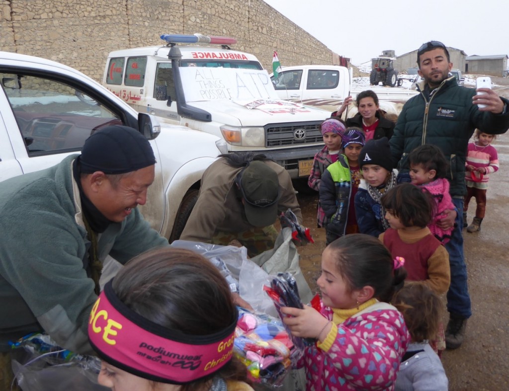 Eliya, Karen Medic hands out gifts to children on Sinjar mountain