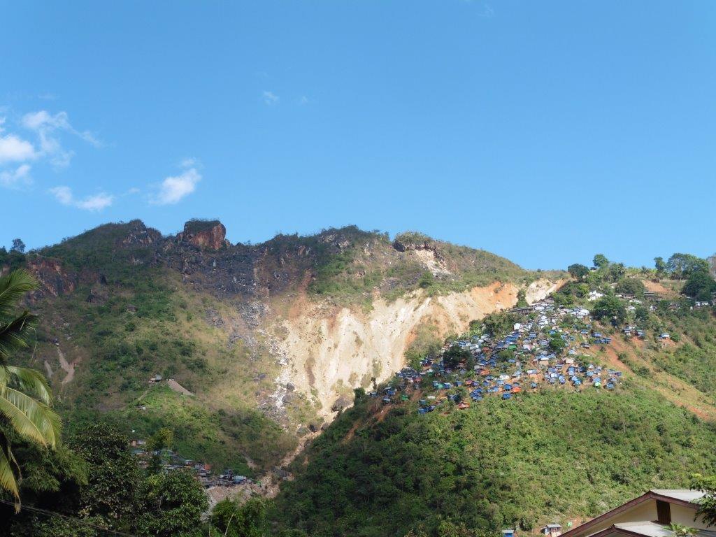 View of Maw Chee showing scars from shaft mines owned by Yay Toh Kyaw Company