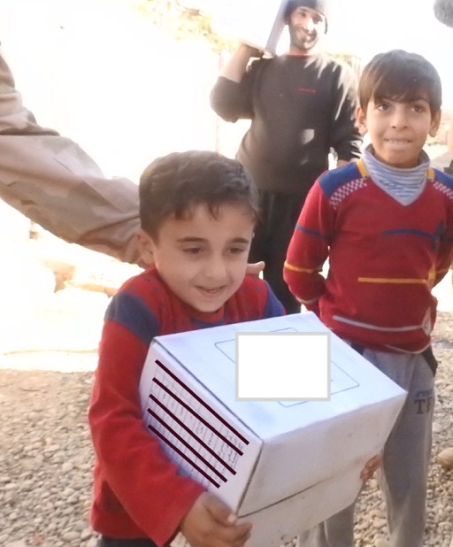 Child with food box. Photo: FBR.