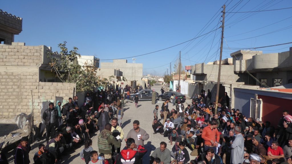 Distribution of aid outside of where ISIS attacked our position the day before. Photo: FBR.
