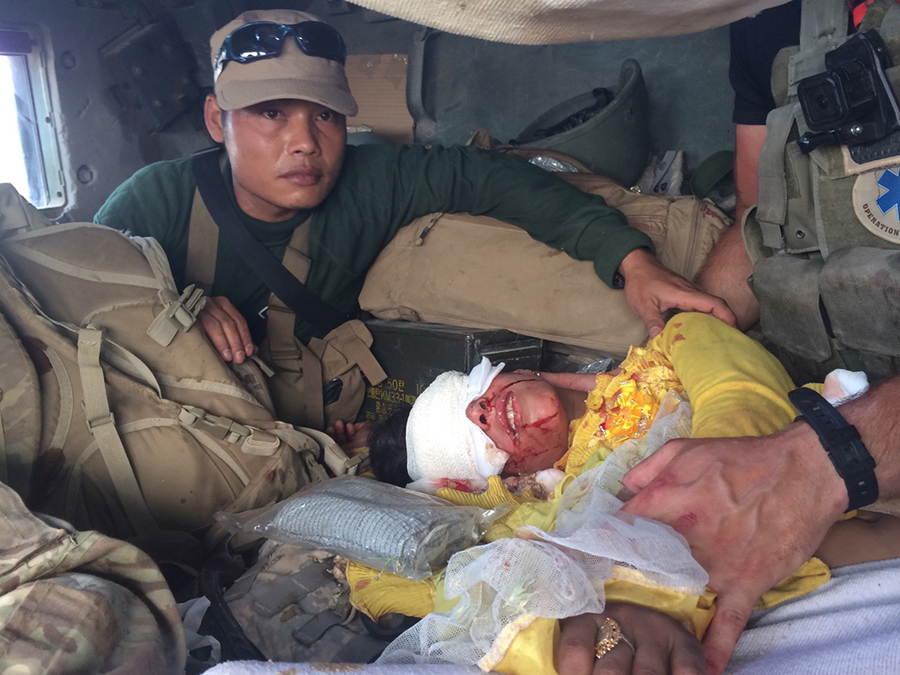 Slowly in our shot up Humvee helping keep the girl and father alive.