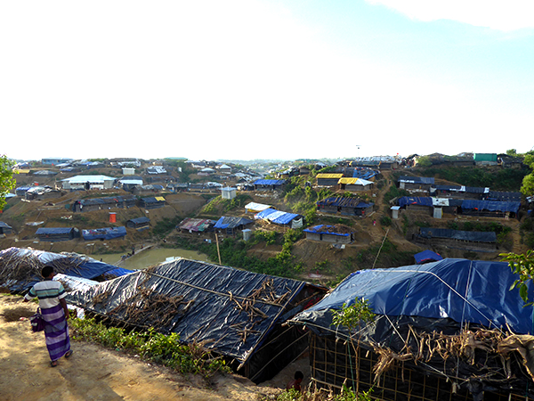 Make-shift homes of bamboo and tarps stretch into the horizon.